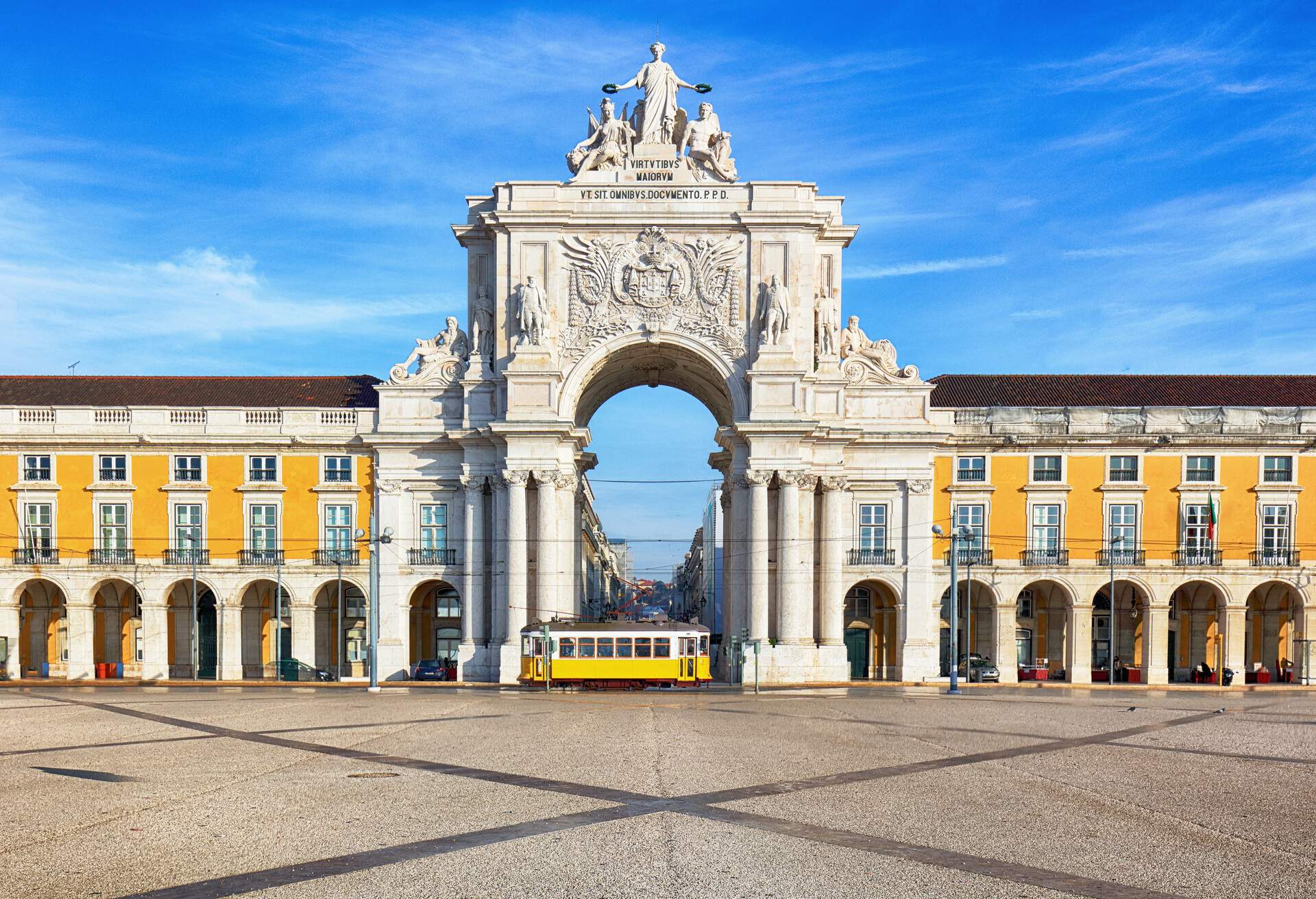 Praca do Comercio with yellow tram, Lisbon, Portugal