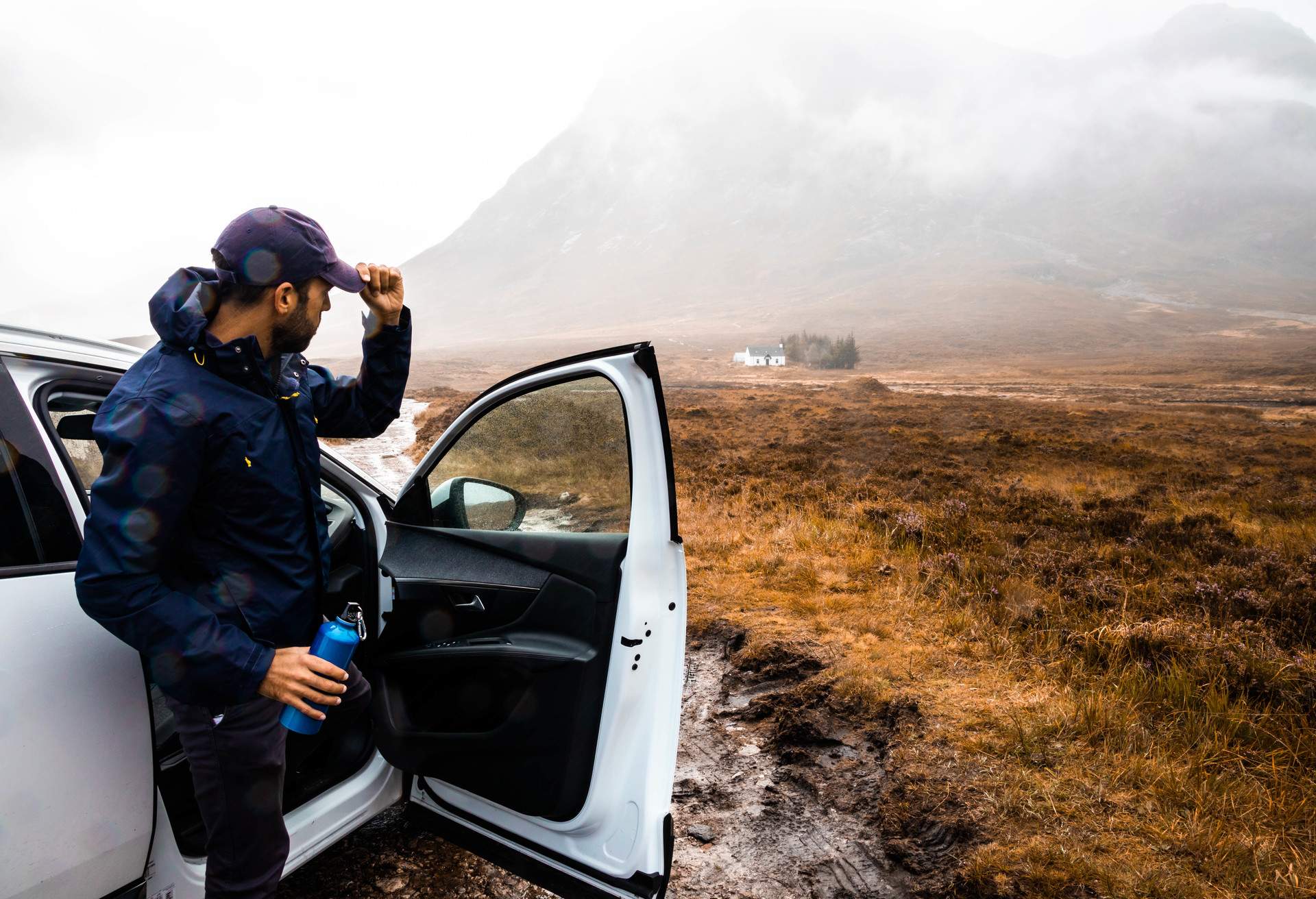 Driving off road with mud and rain in Scotland.