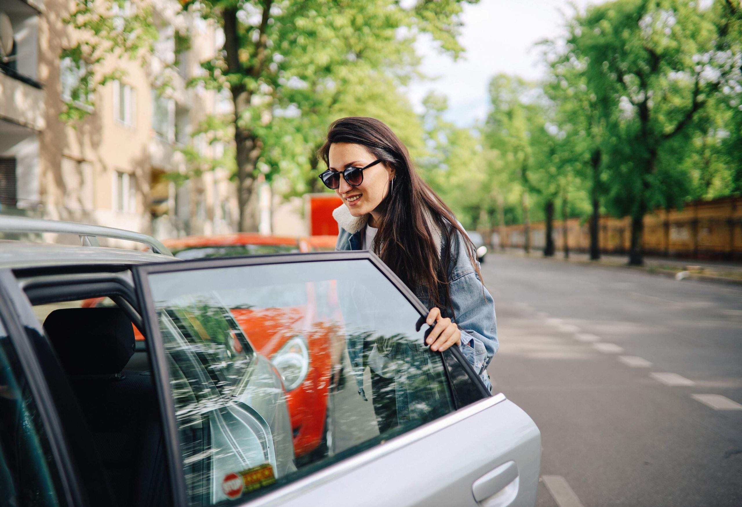 dest_germany_berlin_theme_car_person_driving_travel_rental_gettyimages-1257133581-scaled