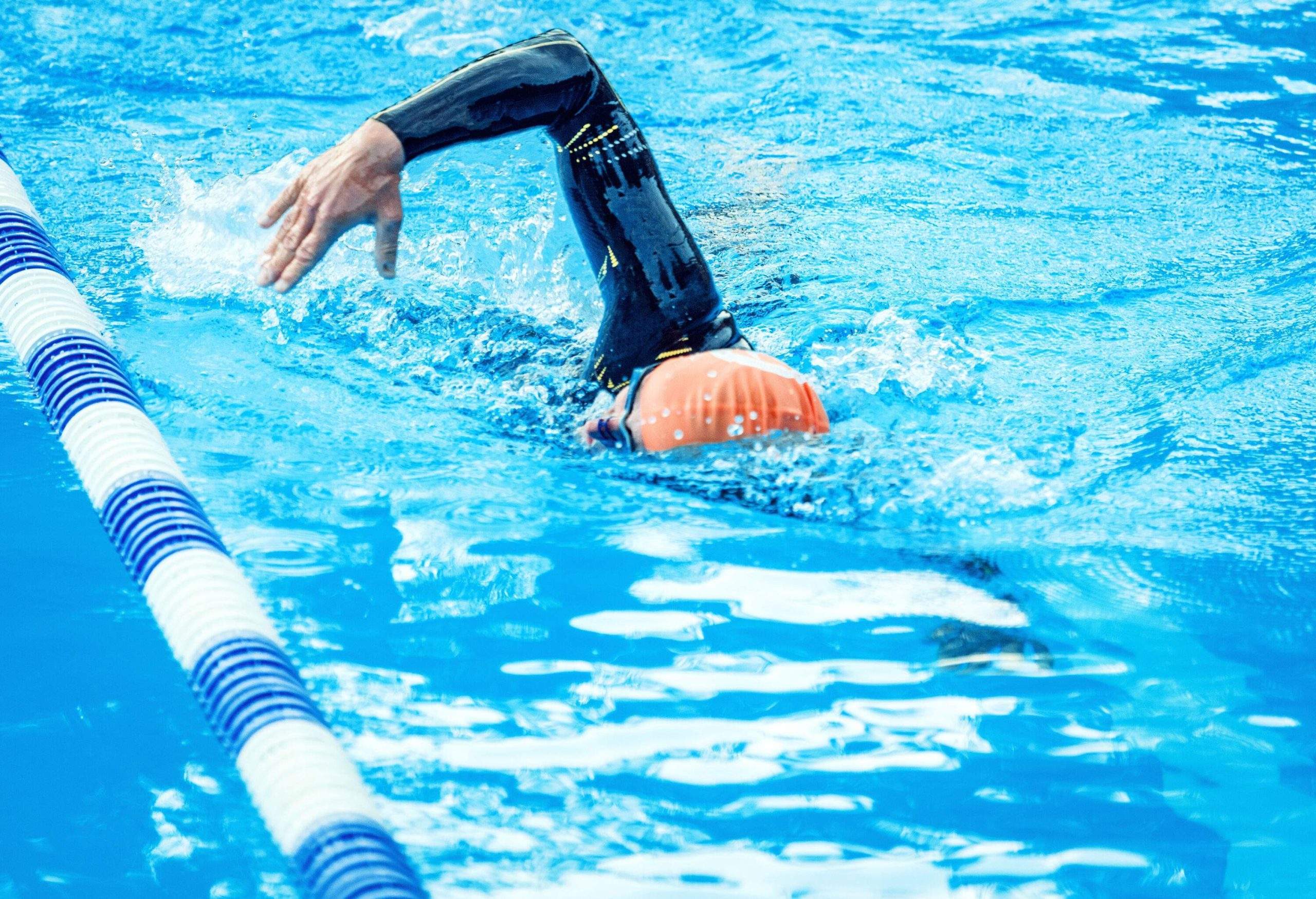 A professional swimmer training in a swimming pool.