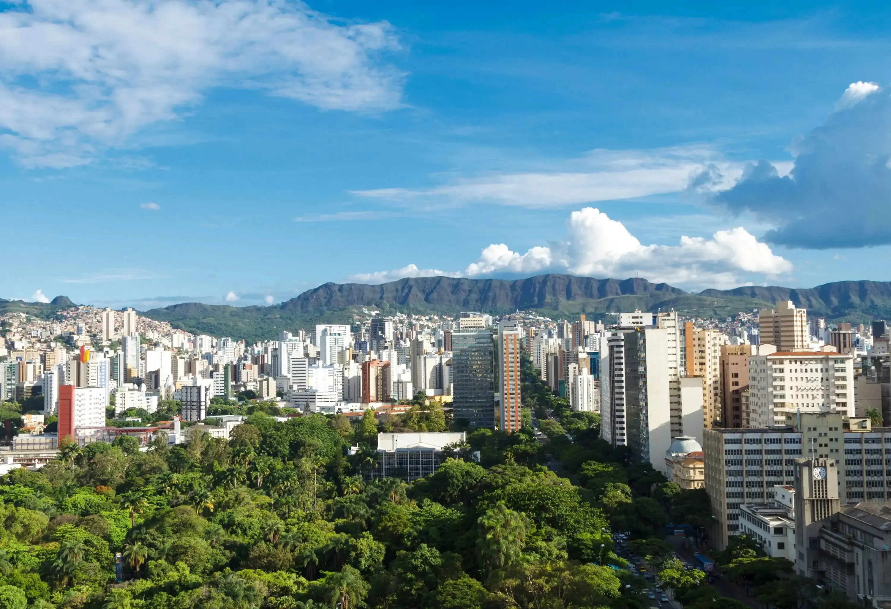 Air panoramic view of Belo Horizonte city, capital of Minas Gerais state, Brazil,with Afonso Pena Avenue, City Park and buildings of the city center in the foreground and the Serra do Curral in the background.