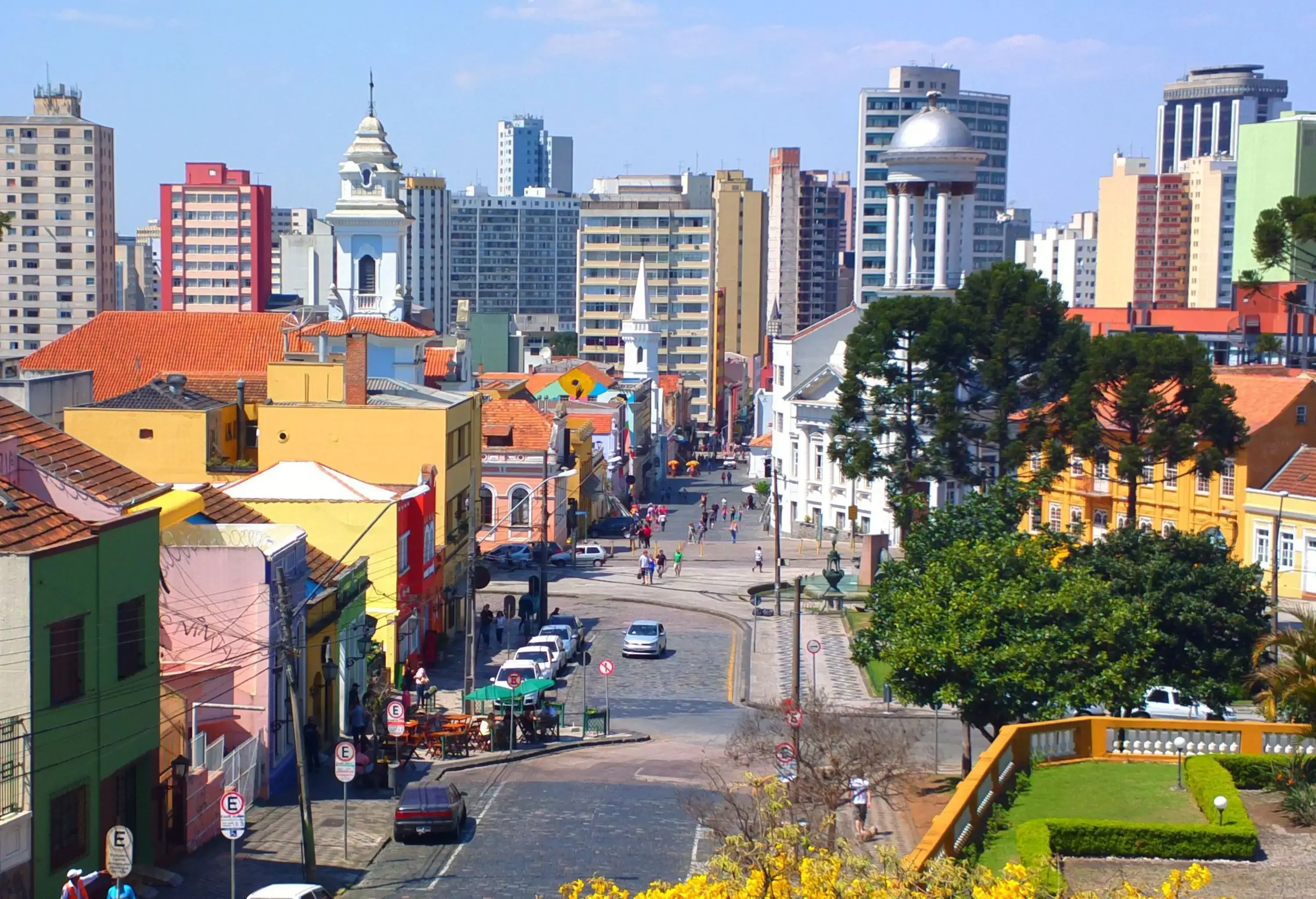 High angle view of a colourful city with colonial style buildings and modern buildings in the background