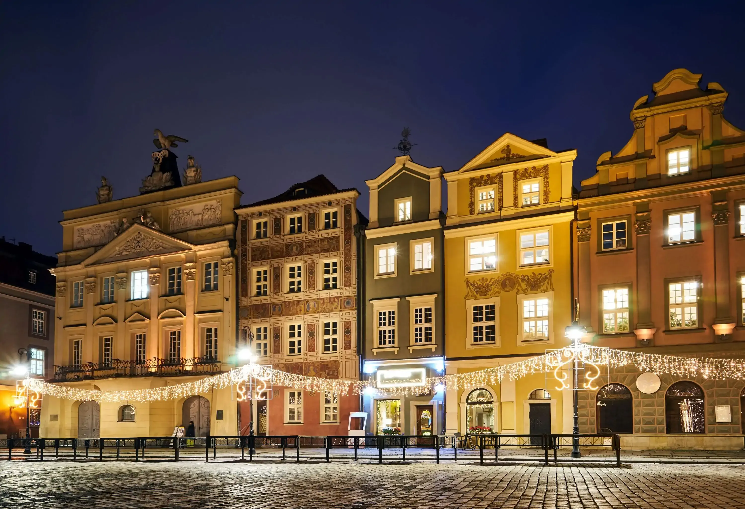The Market Square with historic tenement houses andl and christmas decorations in city of Poznan