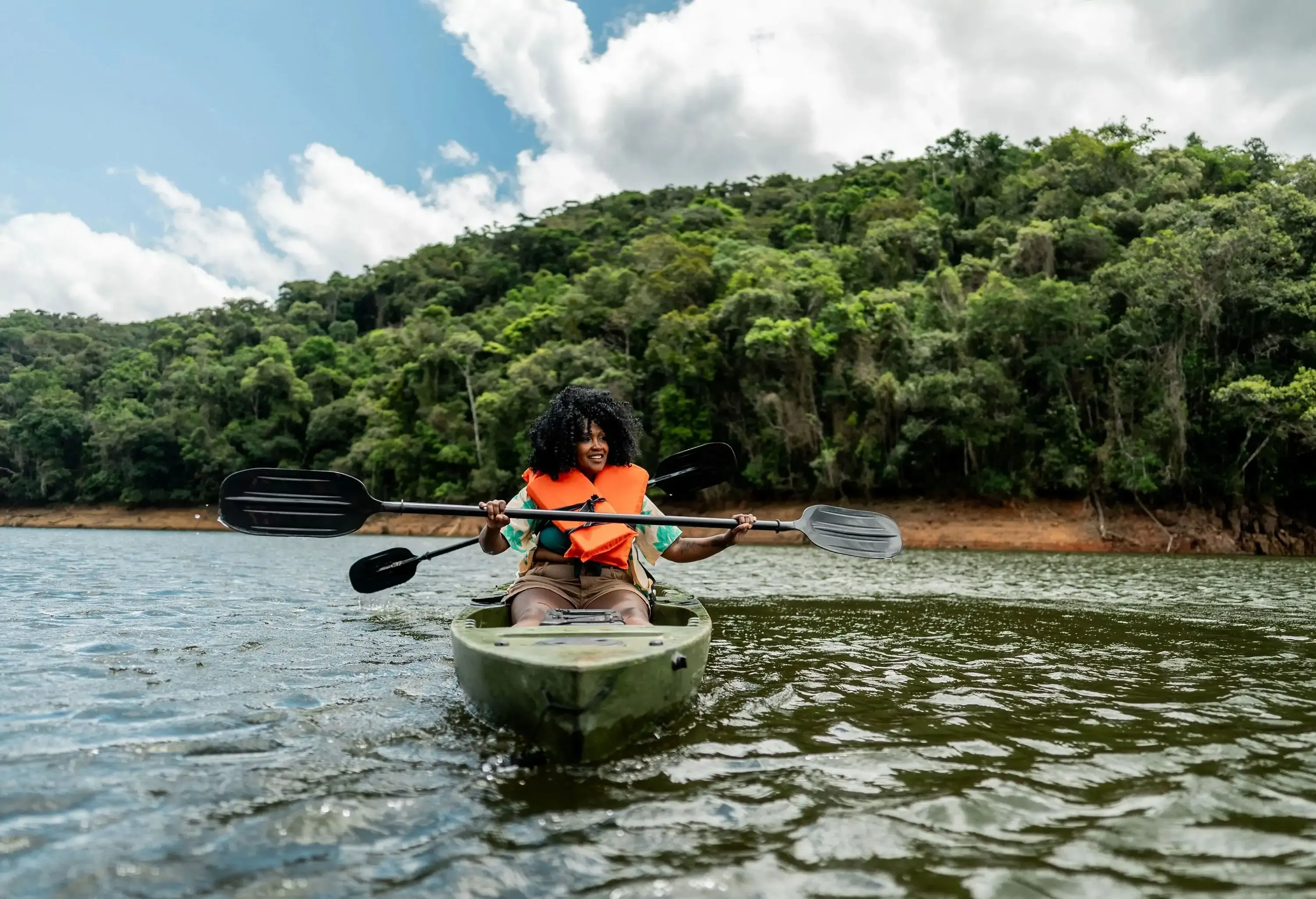 Tourist women enjoying on a sculling boat