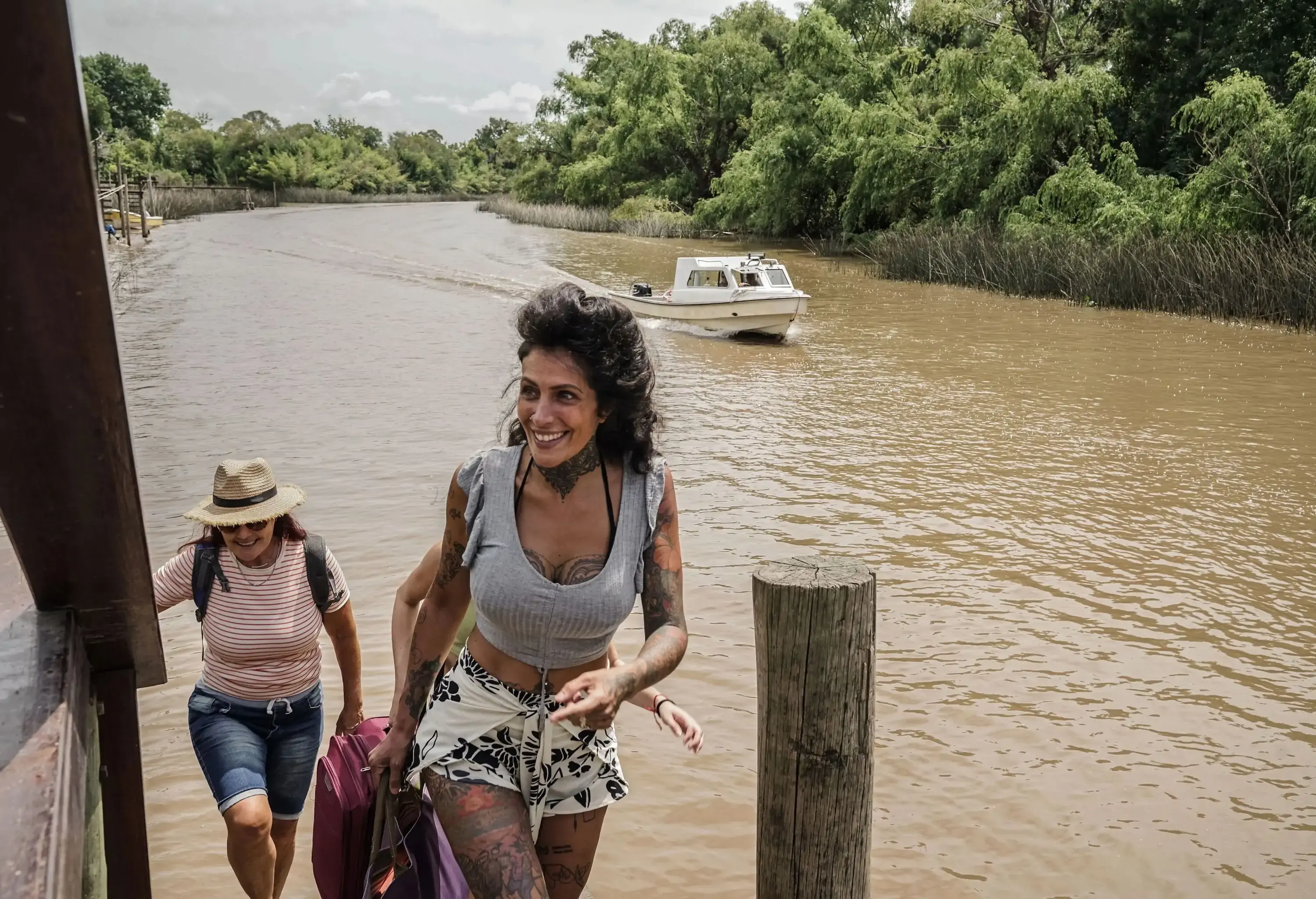 Female friends walking arriving on a eco tourism hotel