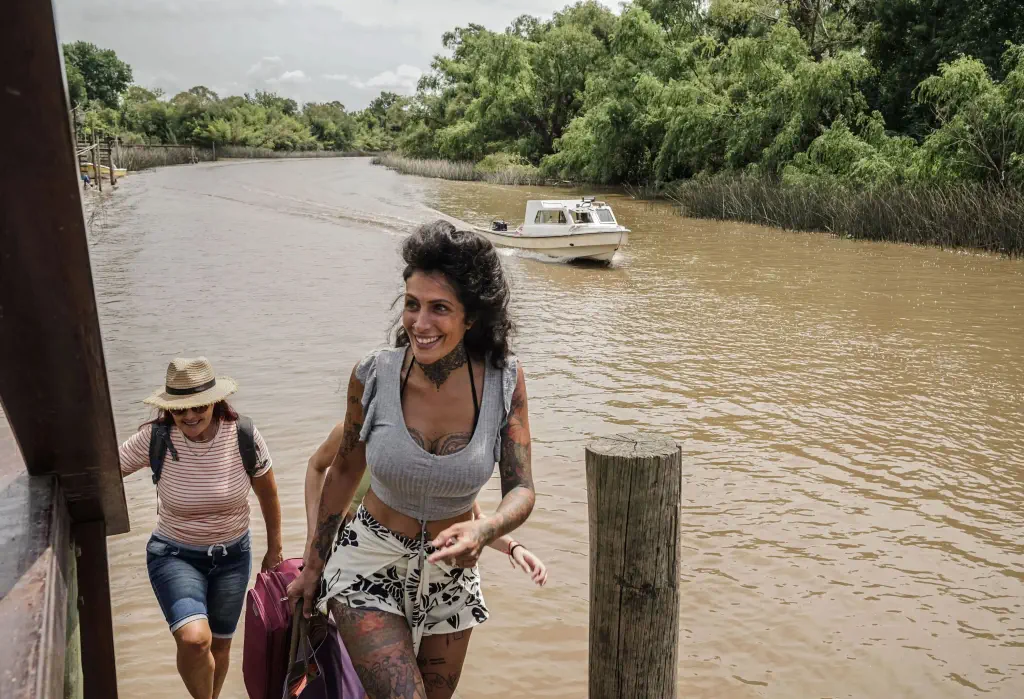 Female friends walking arriving on a eco tourism hotel