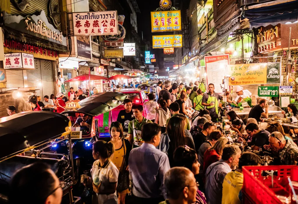 A bustling crowd fills Chinatown in Bangkok, famous for its incredible street food, which draws visitors from far and wide.