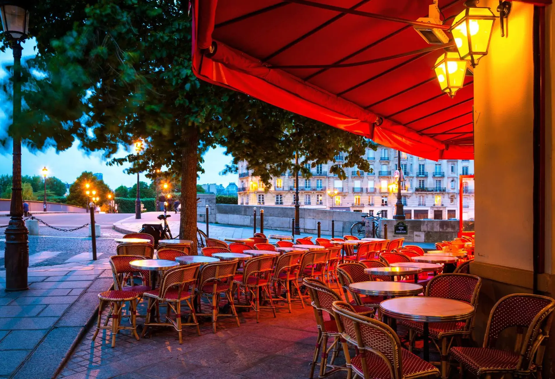 Colorful tables and chairs in sidewalk cafe